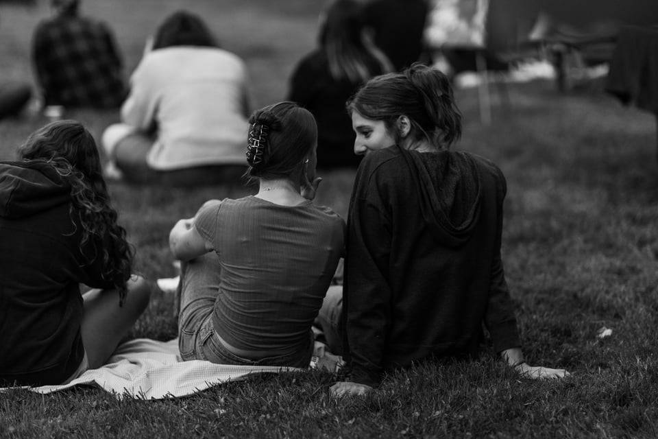 people listening to music on blankets